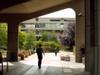 Walking underneath the archway of the Roger Stevens Building